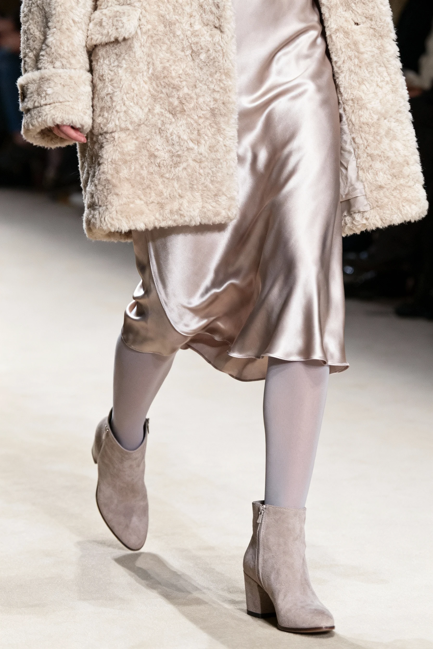 closeup teddy coat, satin slip skirt, opaque tights, ankle boots