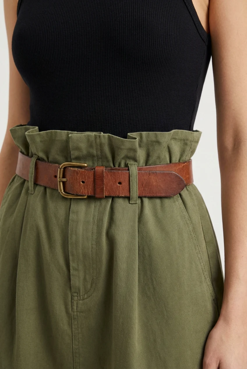 closeup ruffled paperbag waist, fitted bodysuit, leather belt