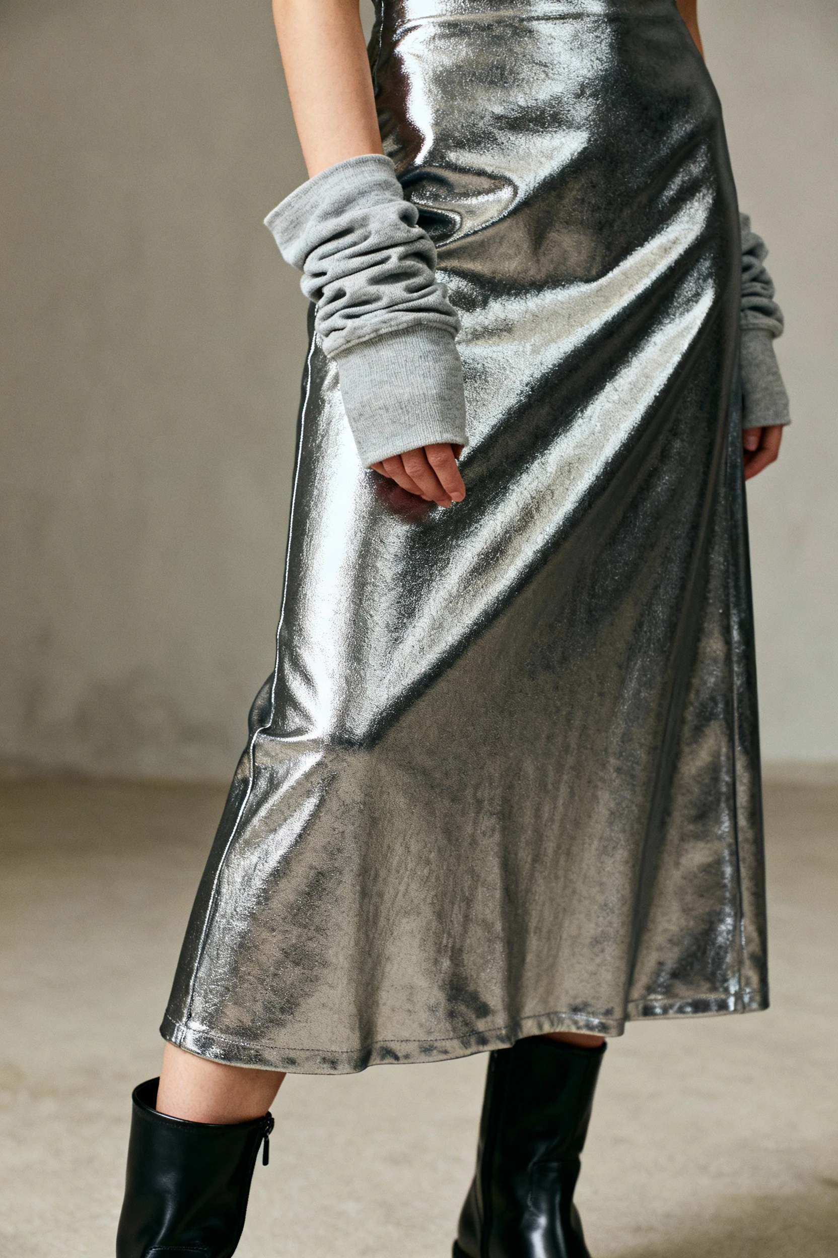 closeup metallic midi skirt with matte boots, pushed sleeves