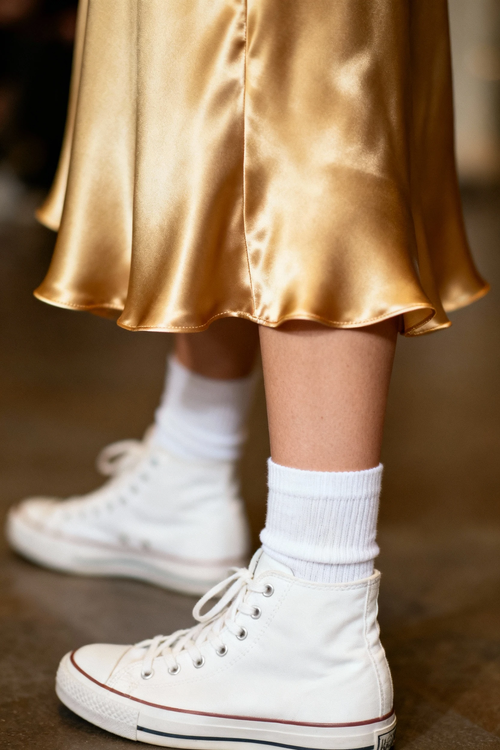 closeup female satin slip dress hem crew socks white high-tops