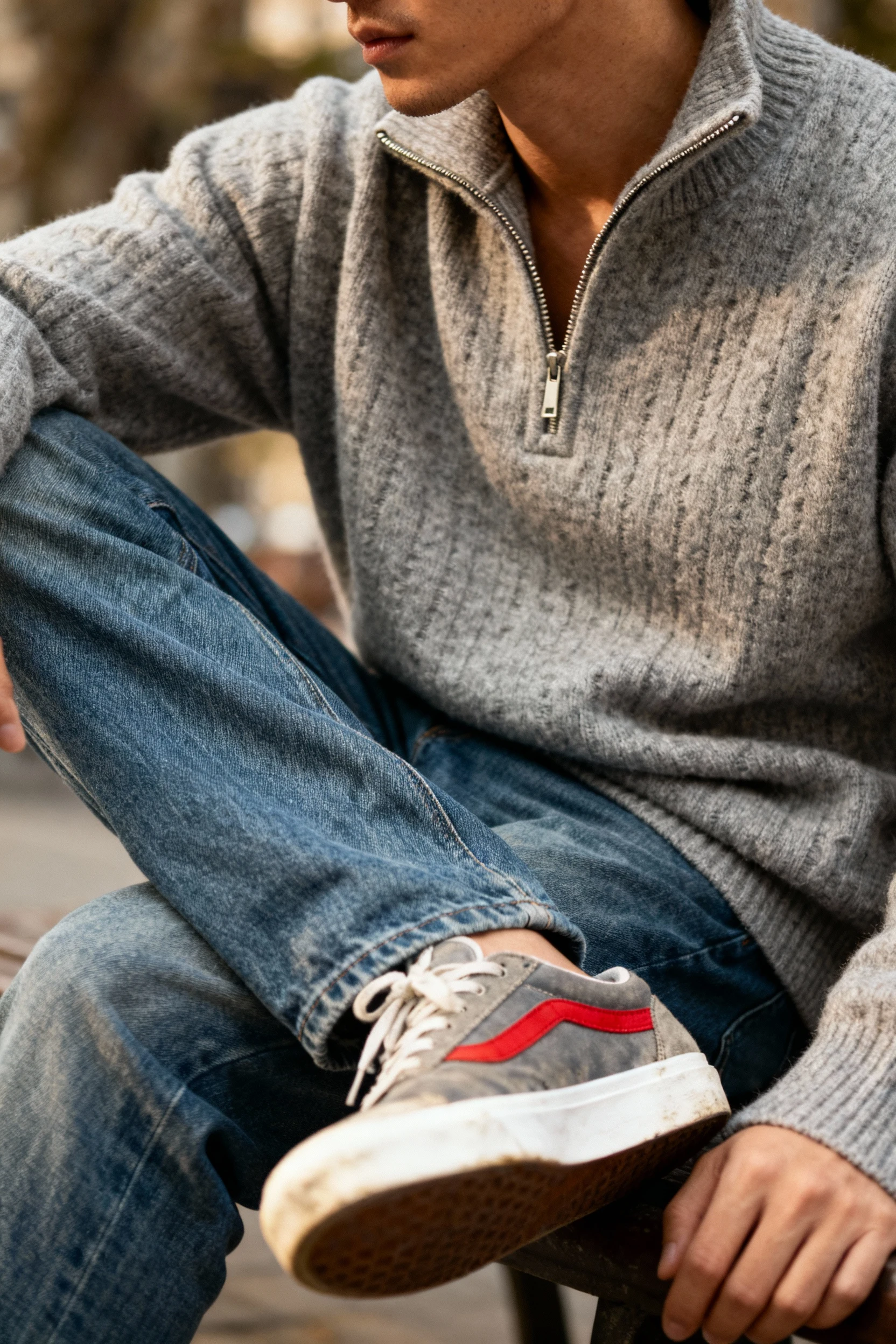 closeup male gray half-zip sweater collar, relaxed jeans, retro runners
