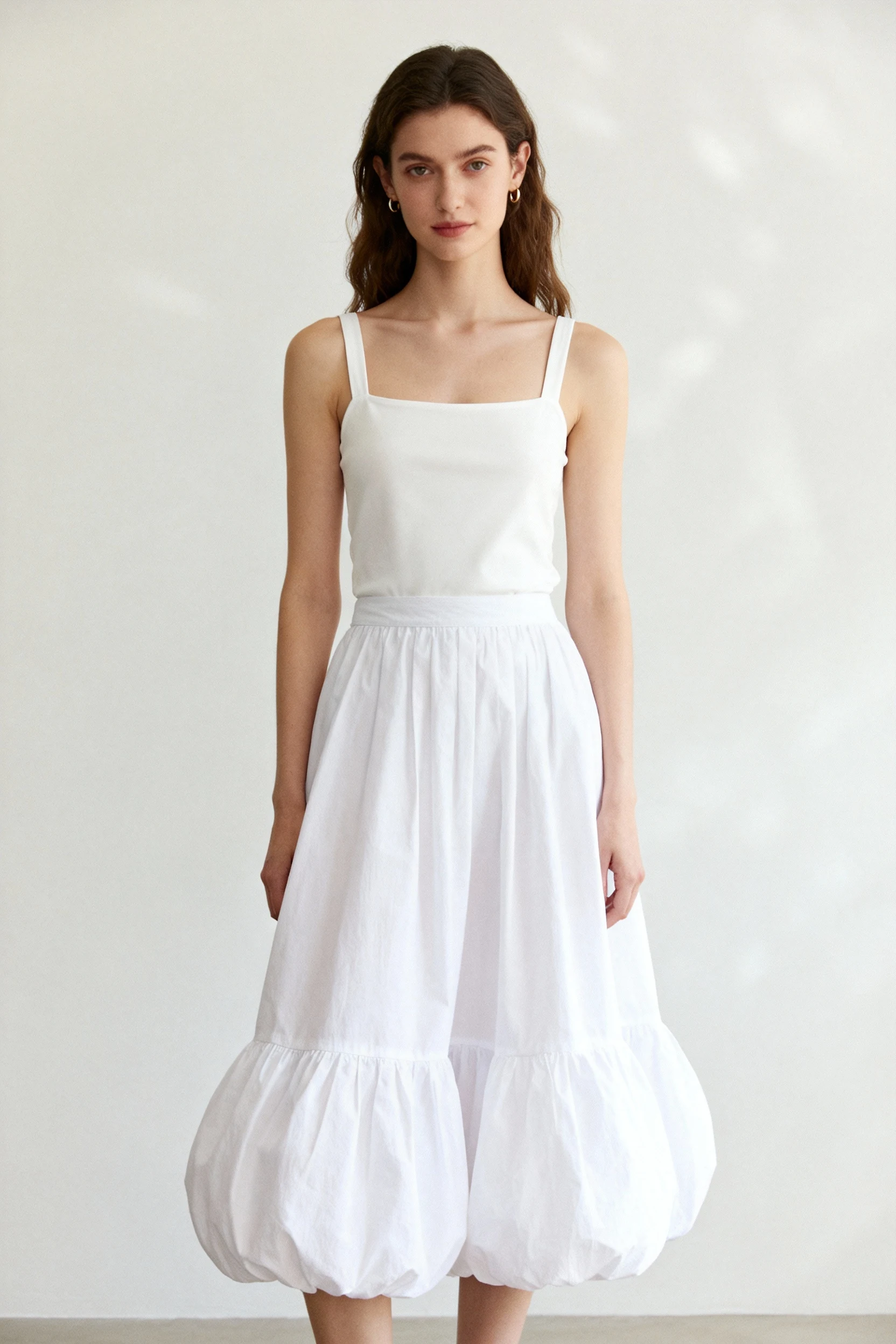 Female wearing white poplin bubble-hem skirt, slim-strap square-neck tank