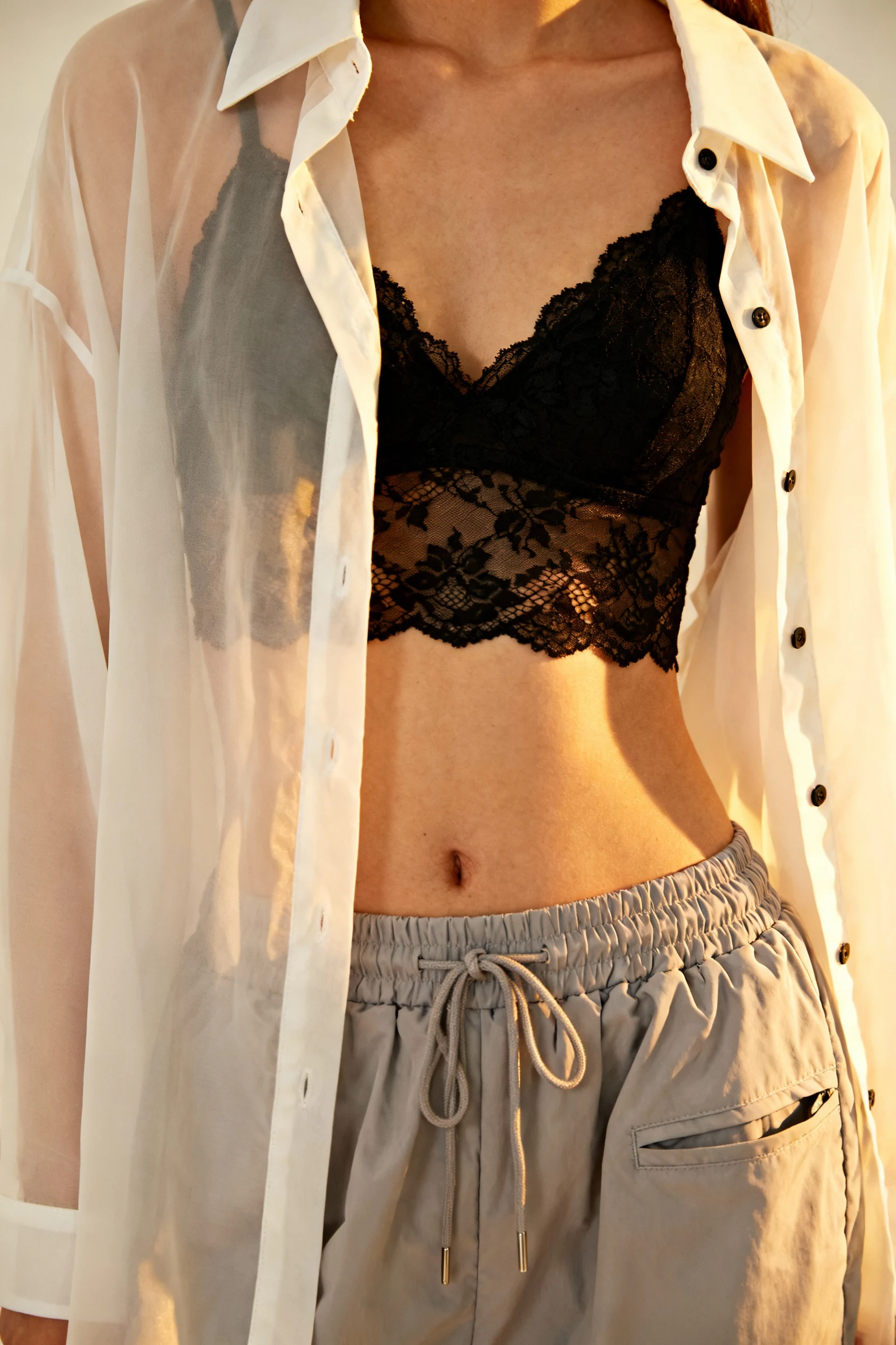 closeup of sheer button-down over bralette, parachute pants drawstring